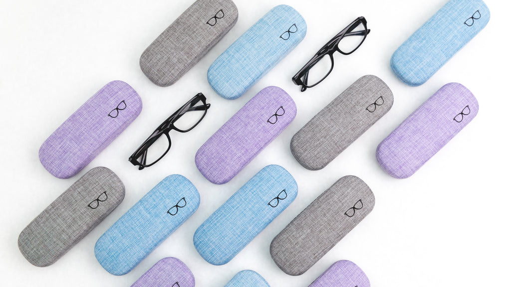 Colorful eyeglass cases with glasses on a white background