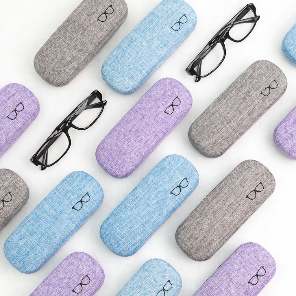 Collection of colorful eyeglass cases with glasses on a white background