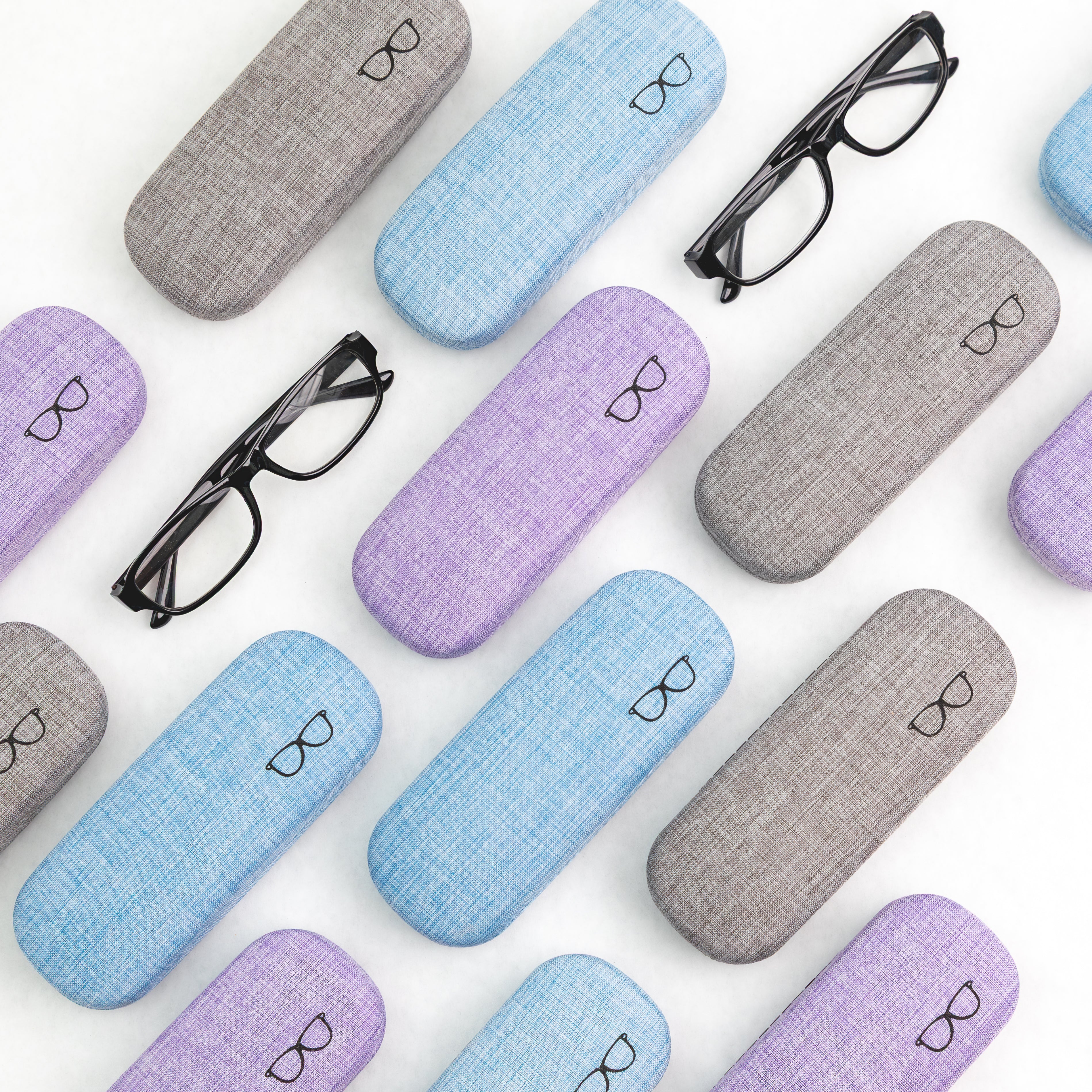 Collection of colorful eyeglass cases with glasses on a white background